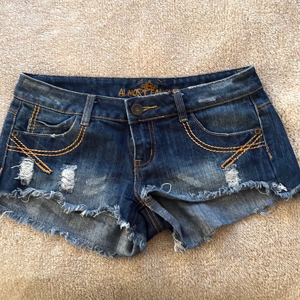 Almost Famous dark blue denim low rise shorts with some distressing. SZ 5